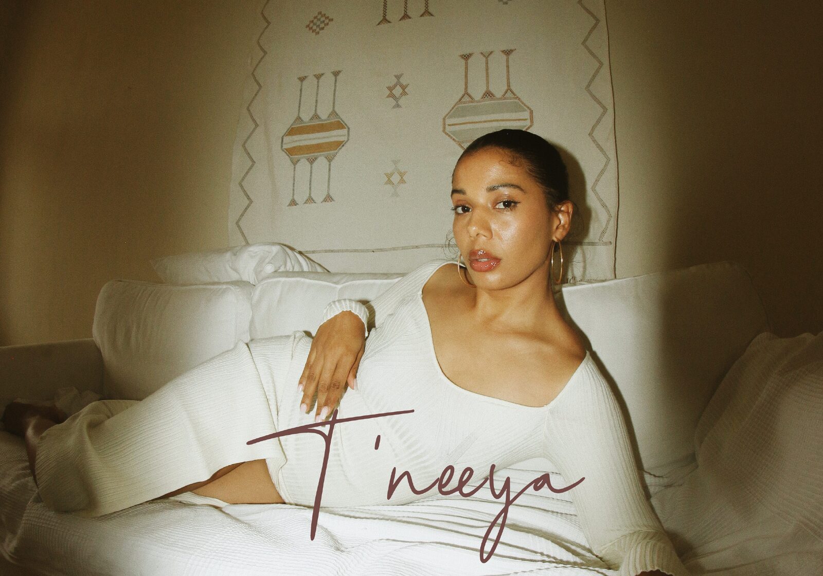 T'neeya in a warm-toned editorial frame